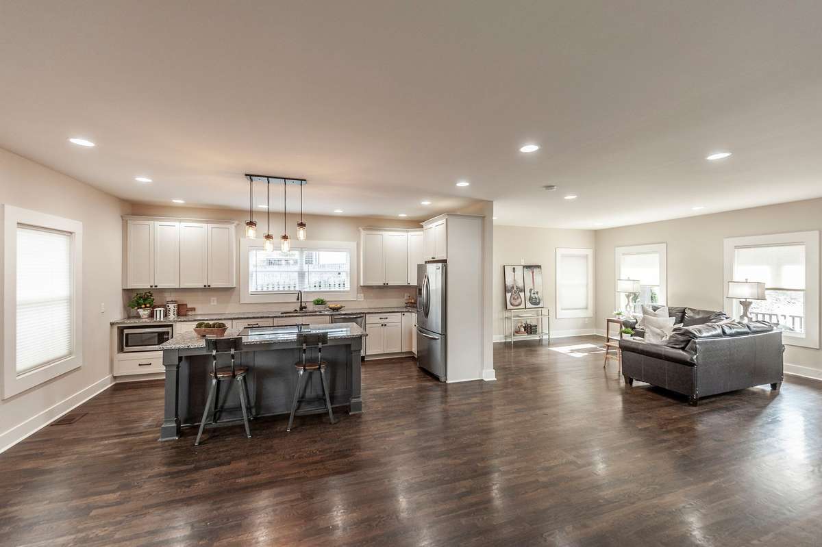 The open kitchen layout allows easy connection to the living and dining areas, perfect for hosting guests.