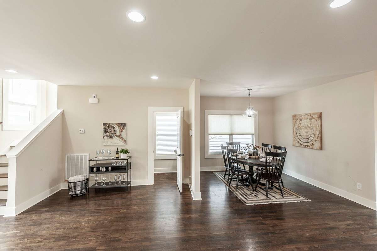 Spacious dining area easily accommodates a full dining set with additional room for a buffet or bar-style furniture.