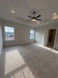 Huge master includes trey ceiling and fan.  Double doors to the master ensuite bath