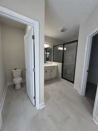 Gorgeous master bath with water closet, split vanities with lots of counter top space.  Tiled walk in shower.  Large walk in closet.