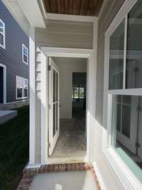 Enters into the rear foyer.