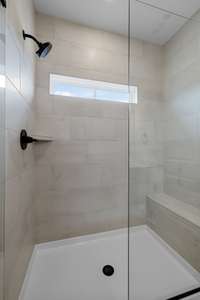 Transom window in shower for lighting.  Bench?  Yes it's included