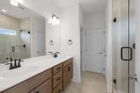 Double Vanities, tile floor, tile shower with bench?  Yes, it's included