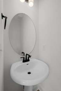 Powder room off of rear foyer