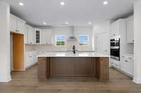 Look at that fabulous Kitchen!! Built in oven/microwave.  Stubbed for gas cooktop.  SS vent hood.  Island!  Walk In Pantry!  What a Kitchen!