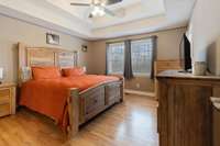 Large Master Bedroom with Door Leading to Back Porch