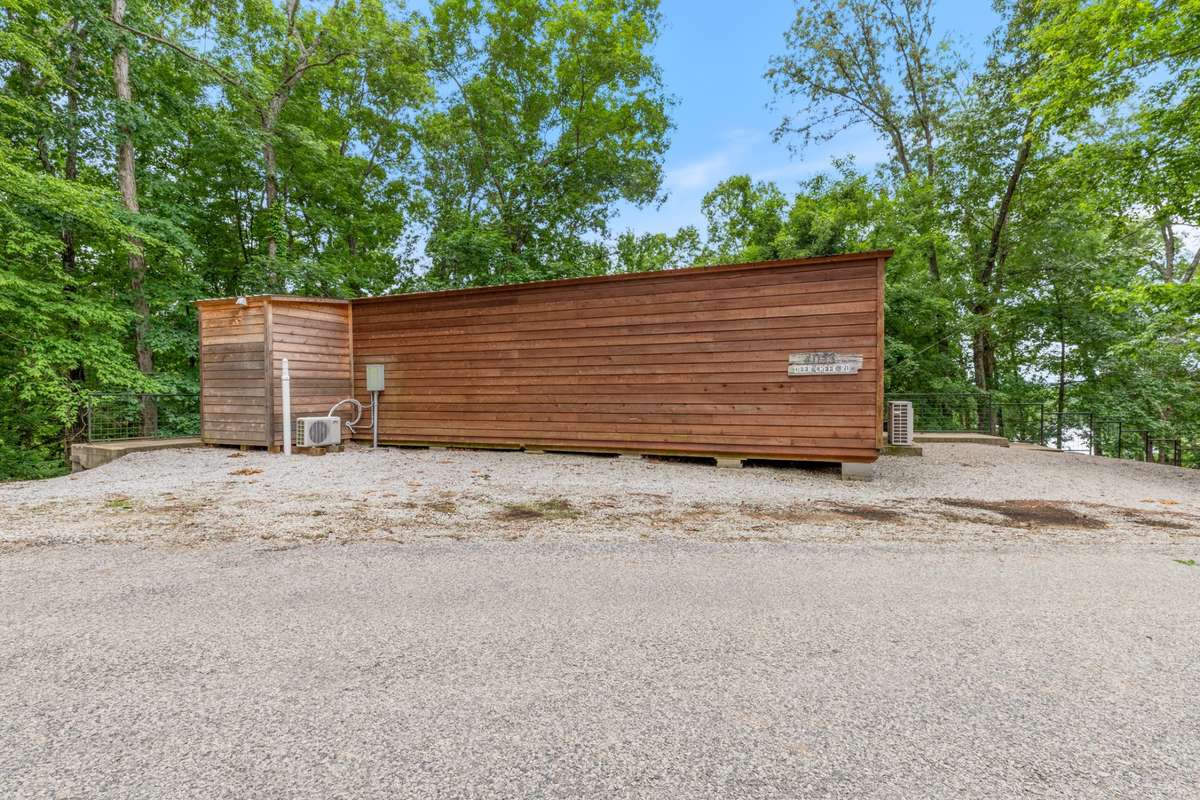 So lovingly named the "Motel 3" by the owners, this 14x42 addition to the property has 3 LARGE bedroom boasting 8 Queen Sized Beds & half bathroom!