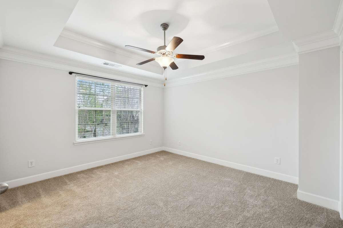 Spacious primary bedroom with trey ceilings, en suite and big walk in closet