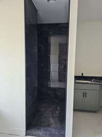 cave shower in primary bath