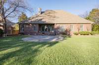 Private backyard with covered porch and open outdoor patio