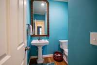 1/2 bath located off the living room