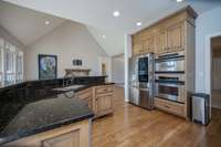 This kitchen is perfect for entertaining guests and having the whole family together at meal time. Features include stainless steel wall oven and microwave, gas cooktop and a refrigerator that is only a year old