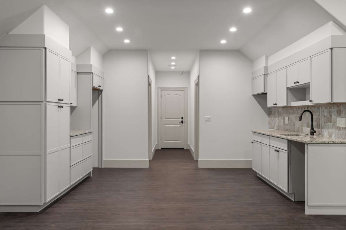 Kitchen area in the attached apartment. The door in the background opens to the main house.