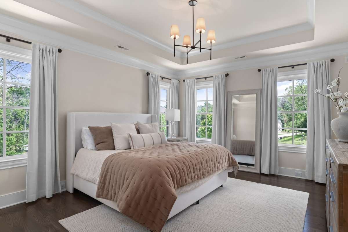 Bedroom 3. Hardwoods and tray ceiling. Big closet, full bath.