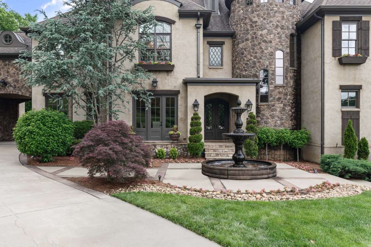Exquisite landscaping sets the tone. Full irrigation system, even the window boxes are self-watering.