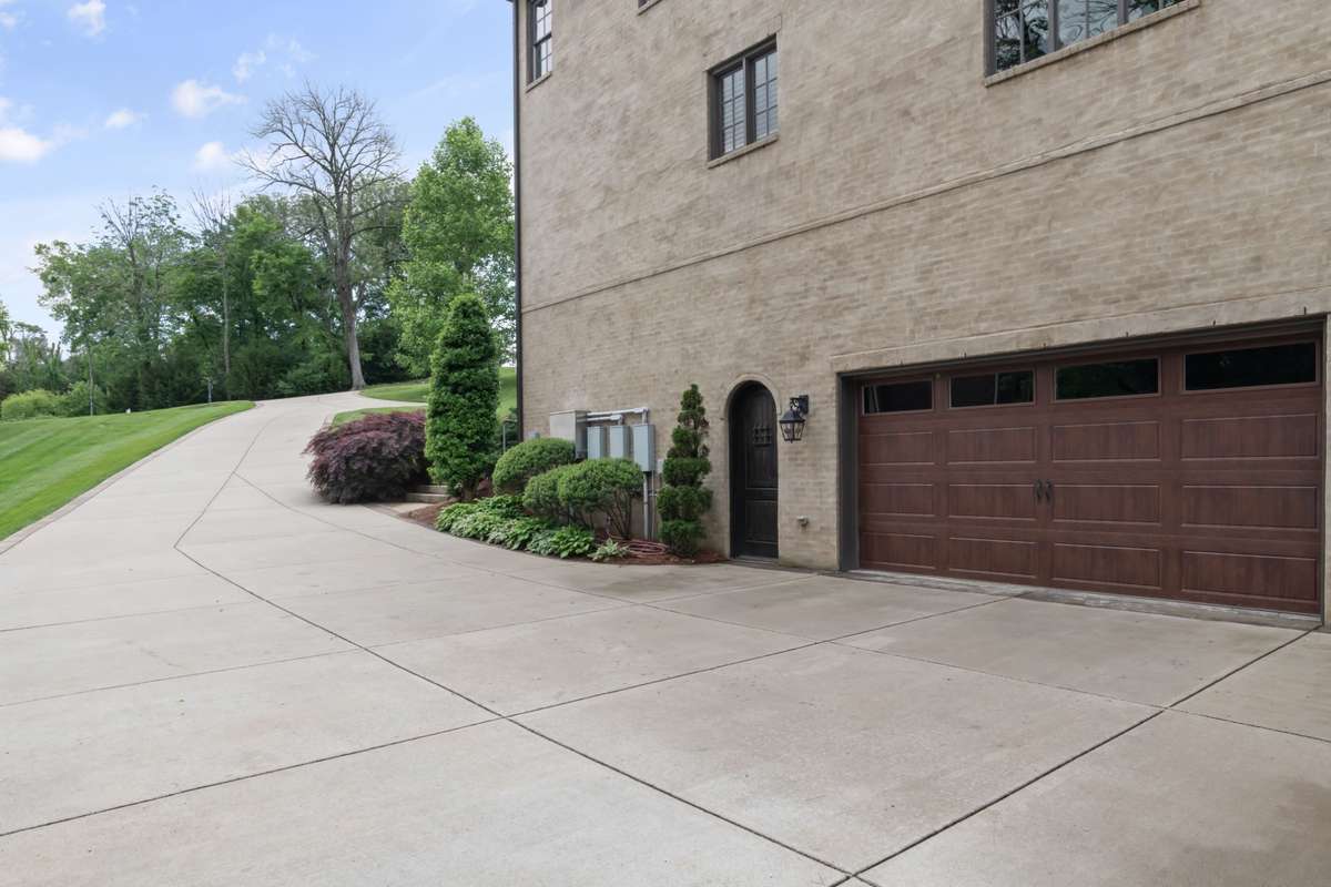 Second two-car garage with additional parking.
