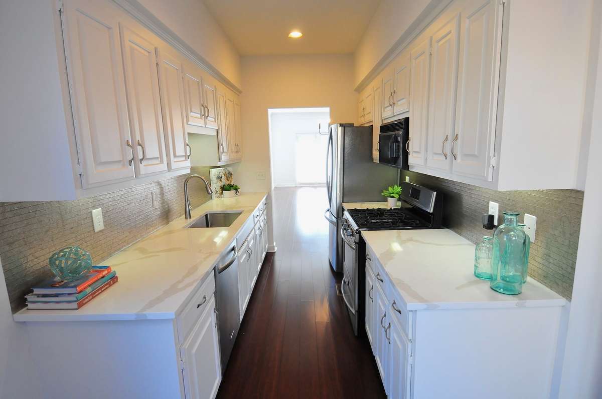 View of the dining room and living room through the kitchen.