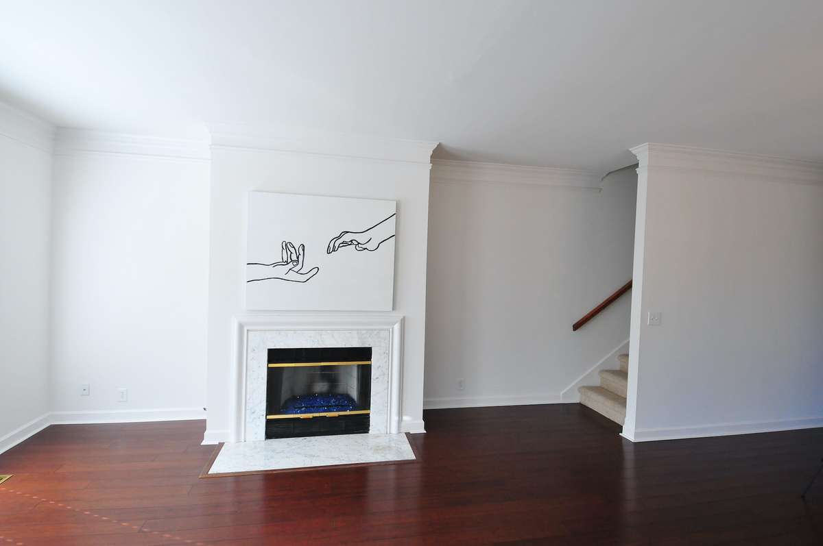 The recess to the left of the gas fireplace provides a perfect spot for shelving.