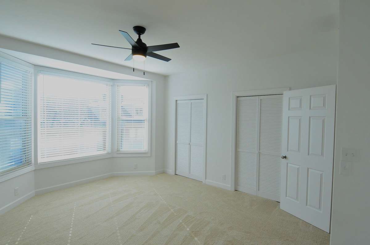 The primary bedroom is located on the second floor and features a bay window and double closets.