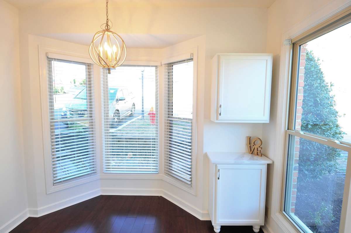 The little pantry cabinets are perfect for a coffee station or a bar. The bay window provides enough room for a round table and a few chairs.