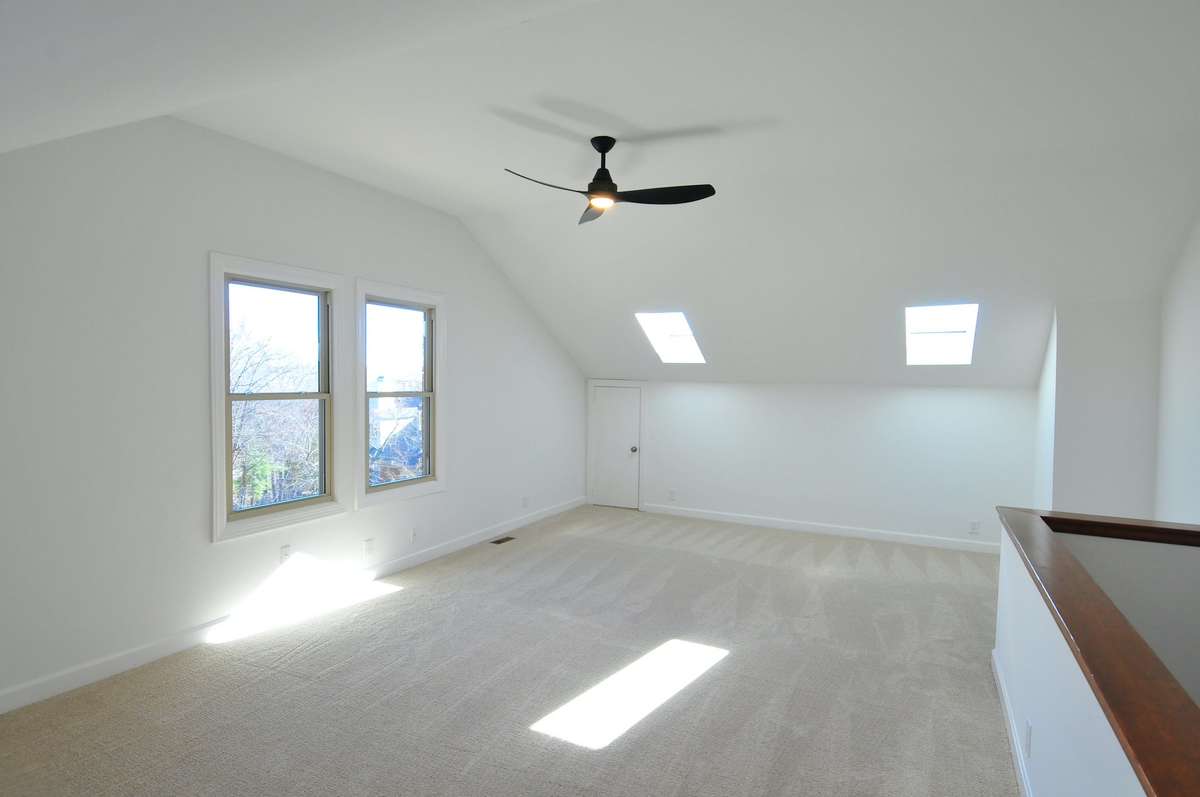 The upstairs bonus room has extra windows on outside wall and the skylights really bring in the natural light.