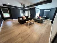 Brand new Finished Walk-out basement - Just completed, this spacious recreation room includes a big screen setup, making it perfect for movie nights, gaming, or a second living space.