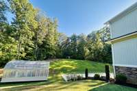 Greenhouse - A gardener's dream, offering year-round growing potential and a unique bonus rarely found in today's market.