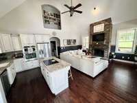 Second perspective of Great Room.  Custom woodwork- thoughtful details throughout, including refinished wood steps, custom trim, and built-ins that add warmth, character and timeless appeal.