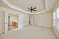 Double doors leading to huge primary bathroom