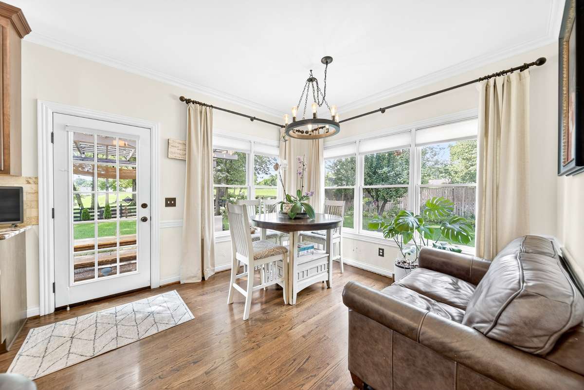 Wall to wall windows showcase views of the beautiful gardens in the backyard.