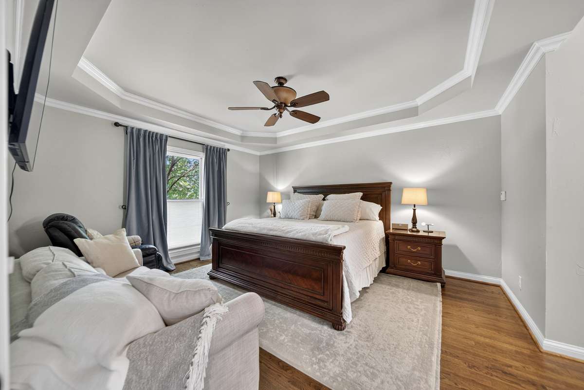 Step into the primary suite highlighted by a trey ceiling that adds depth and character.