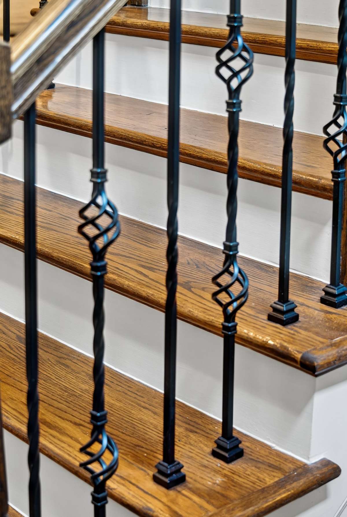 The staircase features hand crafted wrought iron railings that add sophistication and durability.