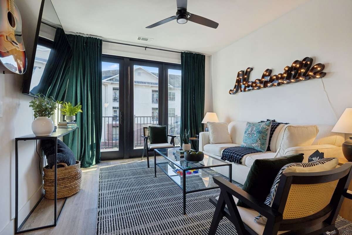 Custom Decorated with a Queen Size Pull-Out Sofa, Large Screen TV, plus Custom Drapes!