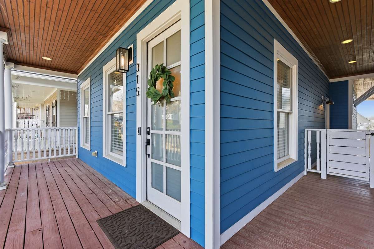 Fenced in side yard and covered porch.