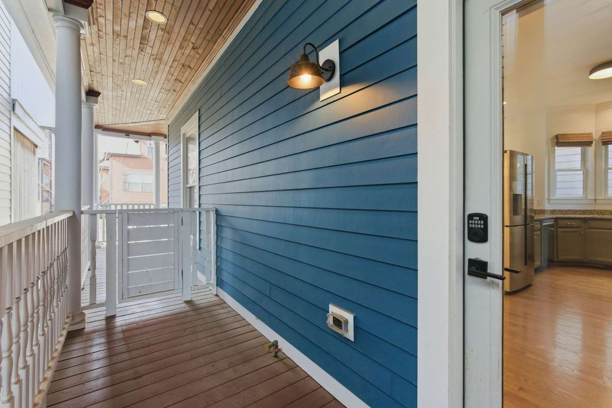 Covered side porch with gate. Gas hook-up for grill.