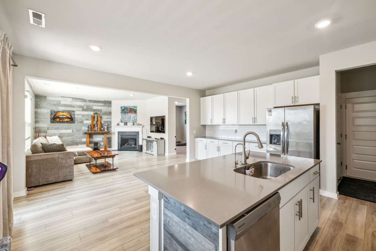 please note: island is now same color as walls and wooden accent wall is now a dark gray accent wall