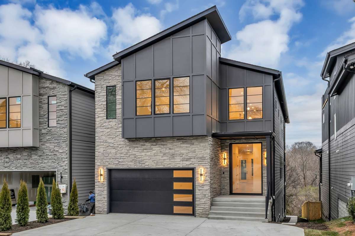 Striking modern elevation with stone accents.