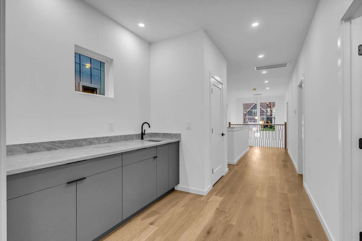 2nd floor wet bar with large quartz countertop for serving