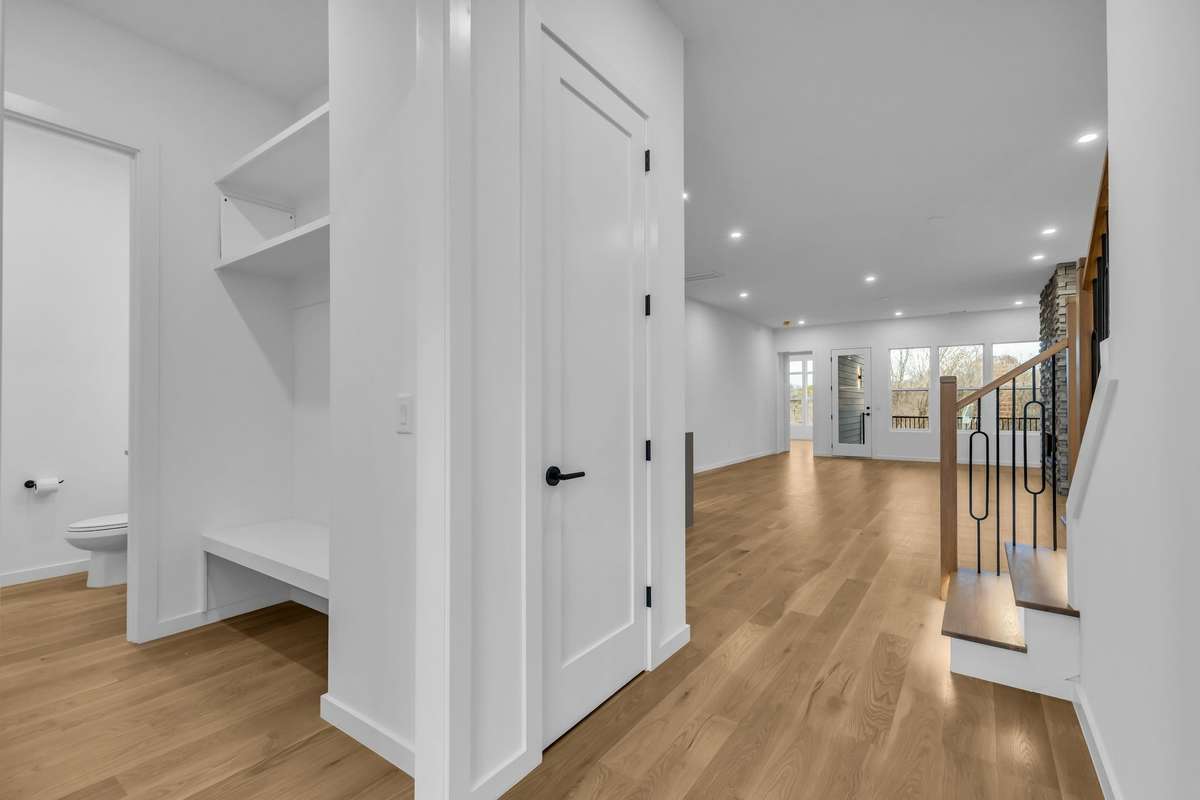Drop zone, coat closet and powder room off the garage entry