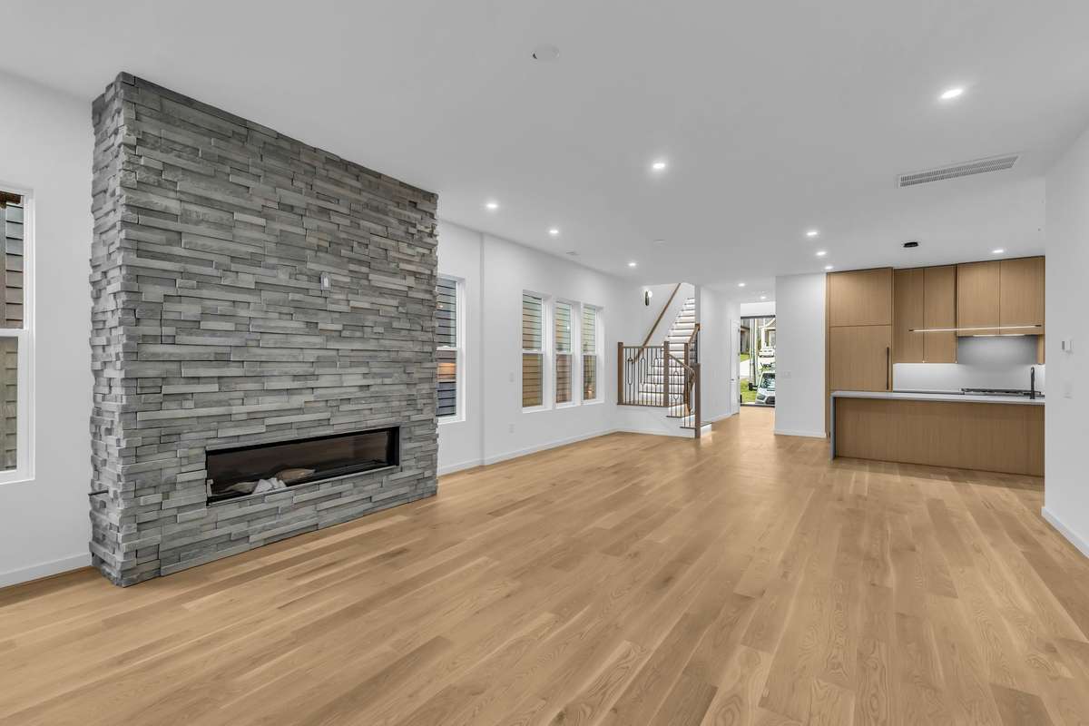 Stacked stone fireplace with linear gas fireplace