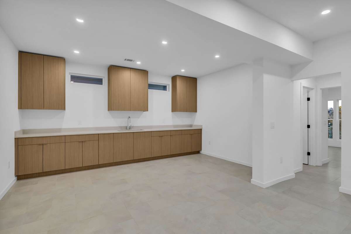 Basement kitchen with the same cabinetry as the main kitchen.