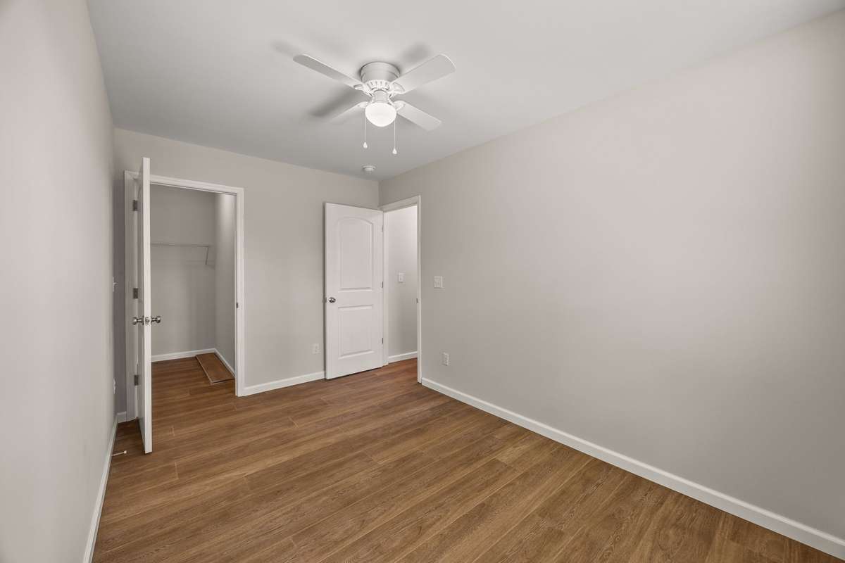 The office/bonus room has a ceiling fan and oversized closet with a view of the back ridge. There are lots of options for what you can do with this space!