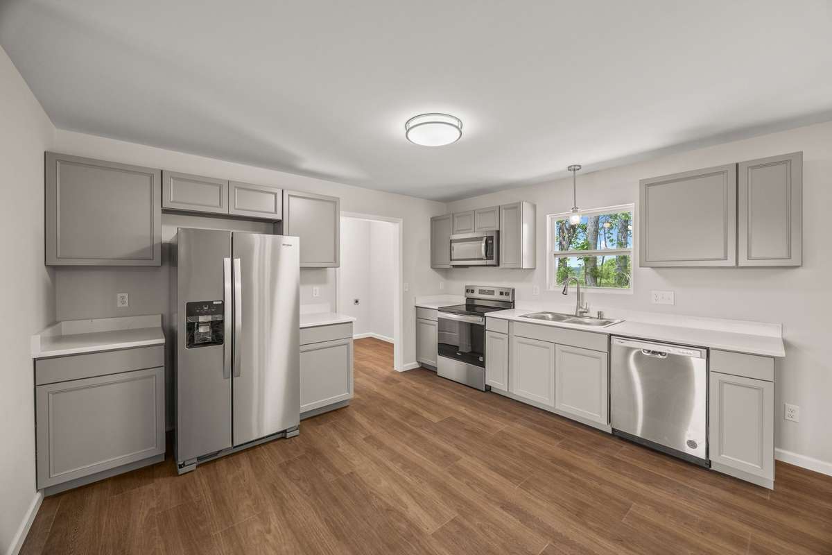 The view from the kitchen window is a favorite! Look out over the ridge & watch the neighboring cows graze! There is a laundry area & large storage closet off the kitchen. Storage or a huge pantry! Either is perfect!