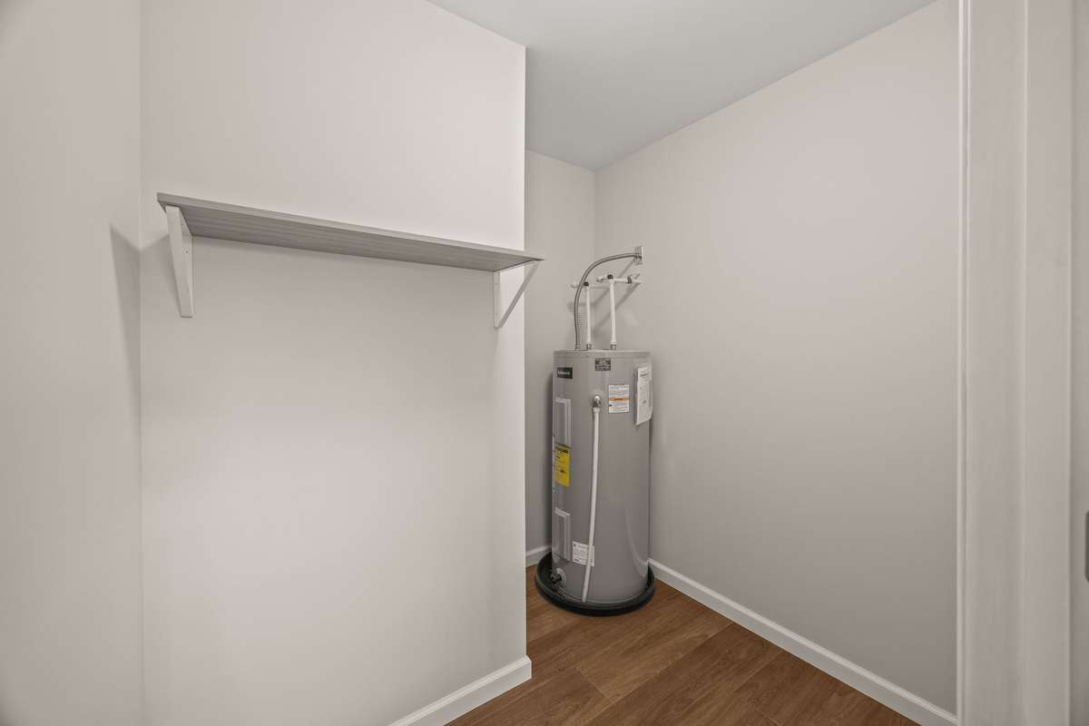 This added storage closet is perfect for extra items or converting into a nice-sized pantry!