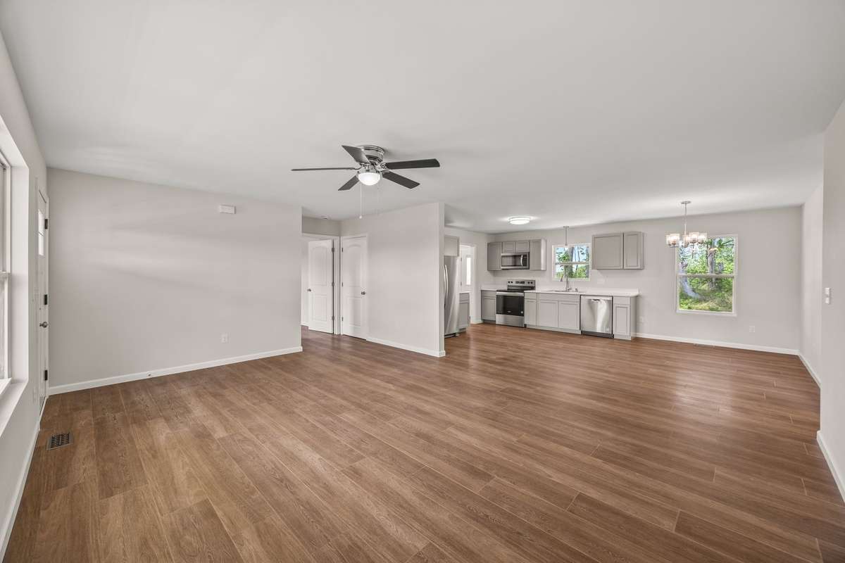 This open floorplan brings a lot of natural light into your home, and you can enjoy entertaining all in one area or expand out onto the decks.