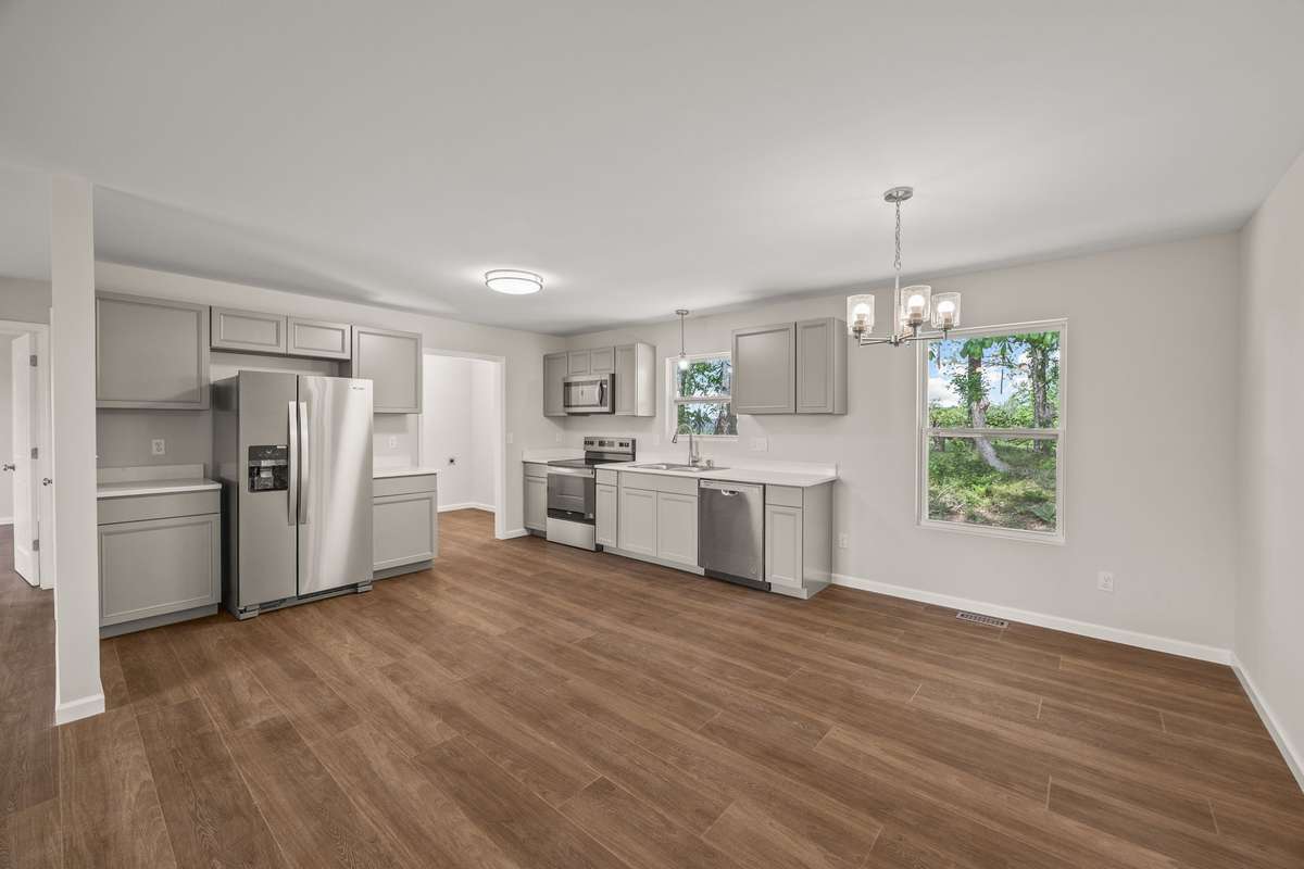 Brand new stainless steel appliances, grey cabinetry, coffee bar, and beautiful waterproof floors make this kitchen/dining combo the perfect fit!