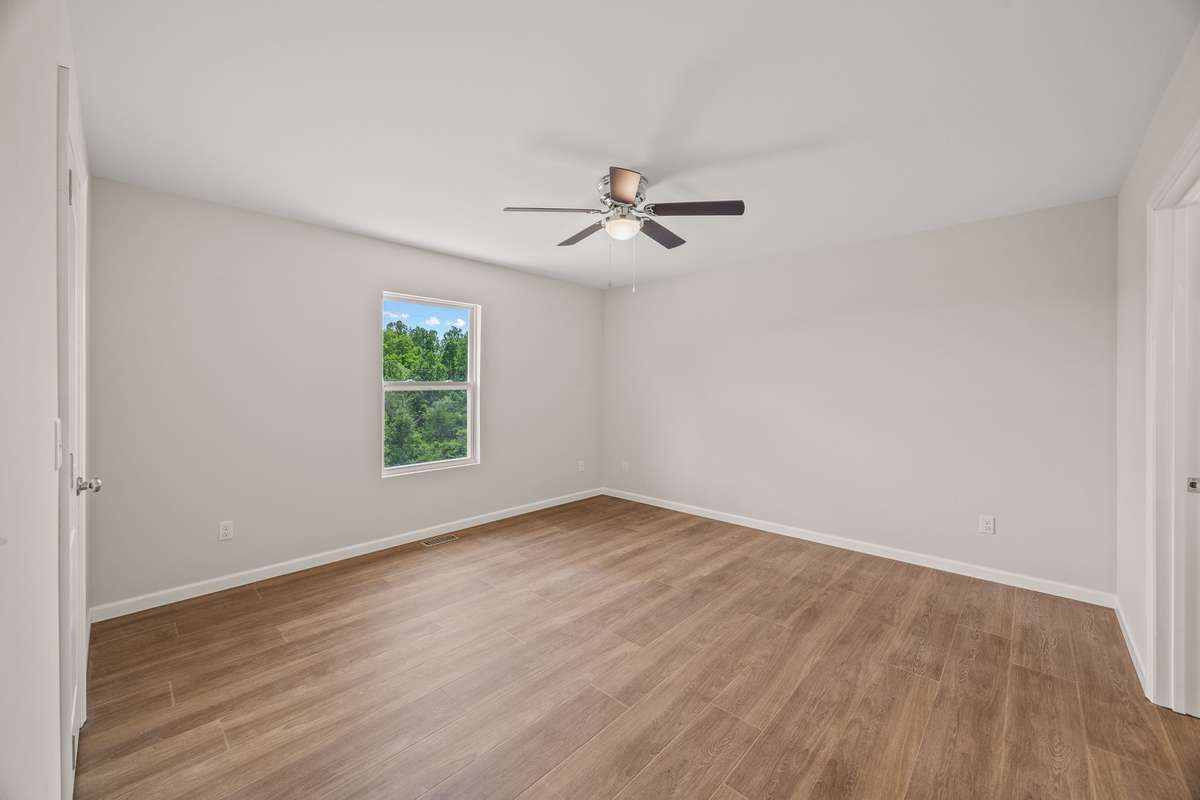 The large Primary bedroom has a beautiful view of the front yard/front ridge area. The Primary suite has an oversized closet and full bathroom with huge walk-in tile shower!
