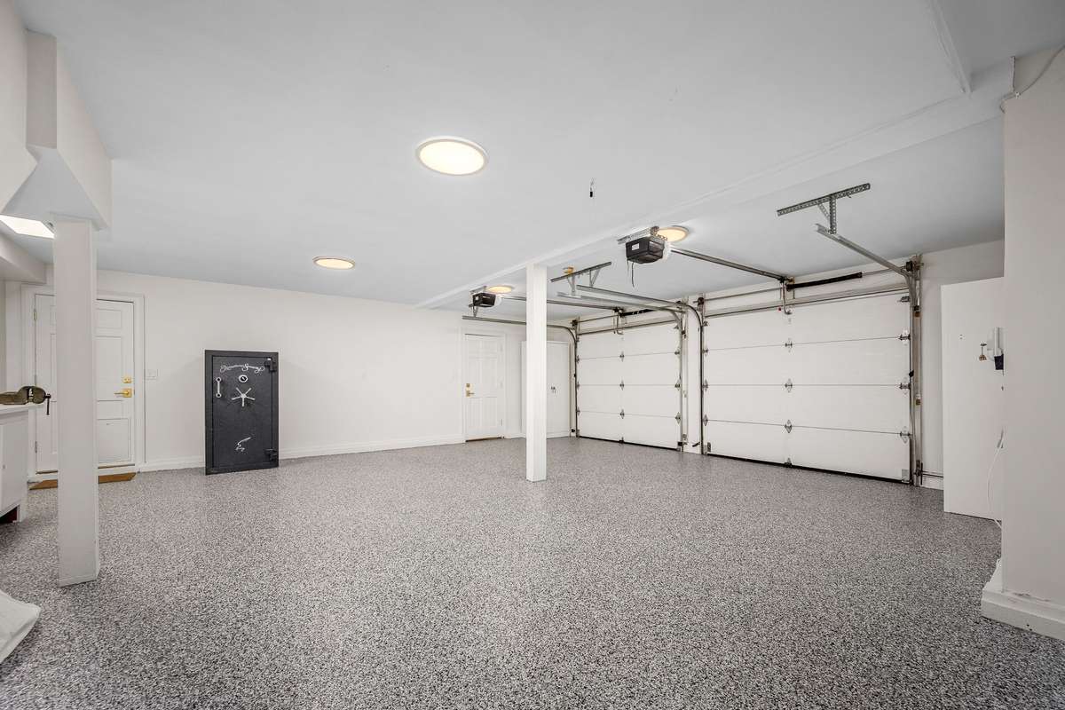 Oversize 2 Car Garage with Large Safe & Workbench.