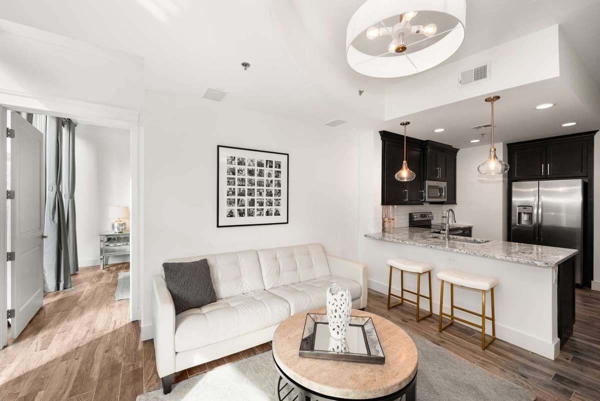 Freshly painted with new lighting, new flooring, and fully renovated kitchen - this spectacular space sparkles!