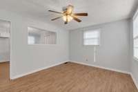 There's an opening from the Living Room into the Dining Area.